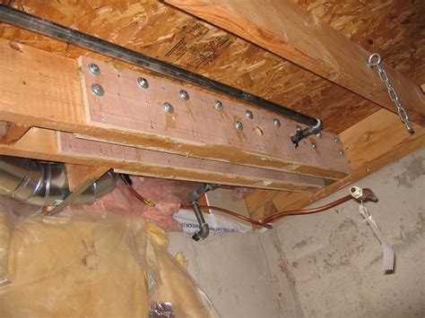 The builders source recommended 14″ lengths of 2×4 with ends of the 2×4’s nailed to the top and bottom flanges. . Floor joist reinforcement for plumbing